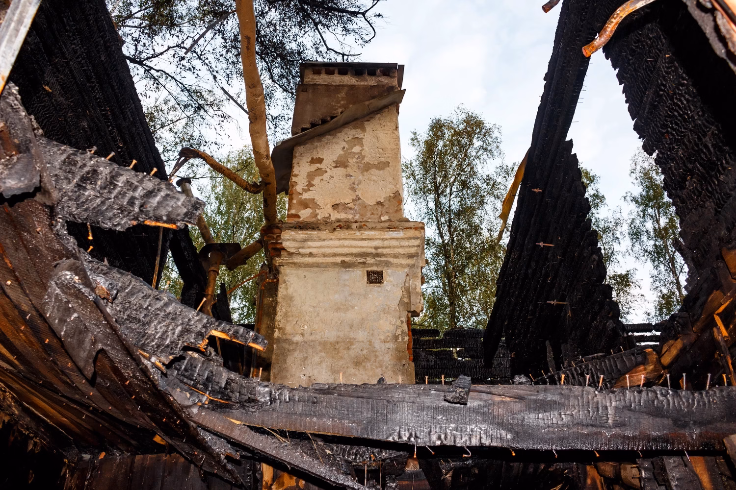 fire damage restoration near me destroyed home interior with chimney and heavy fire and soot damage